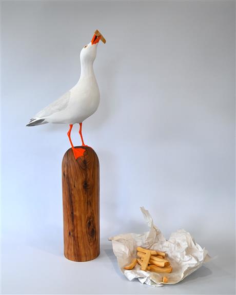 Image of a seagull on a timber post
