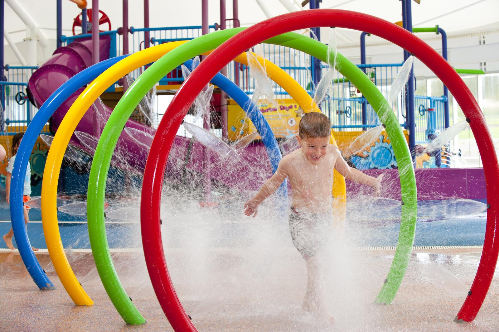 Child playing in water activities