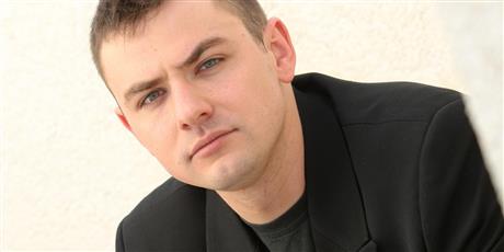 Image of man in black blazer