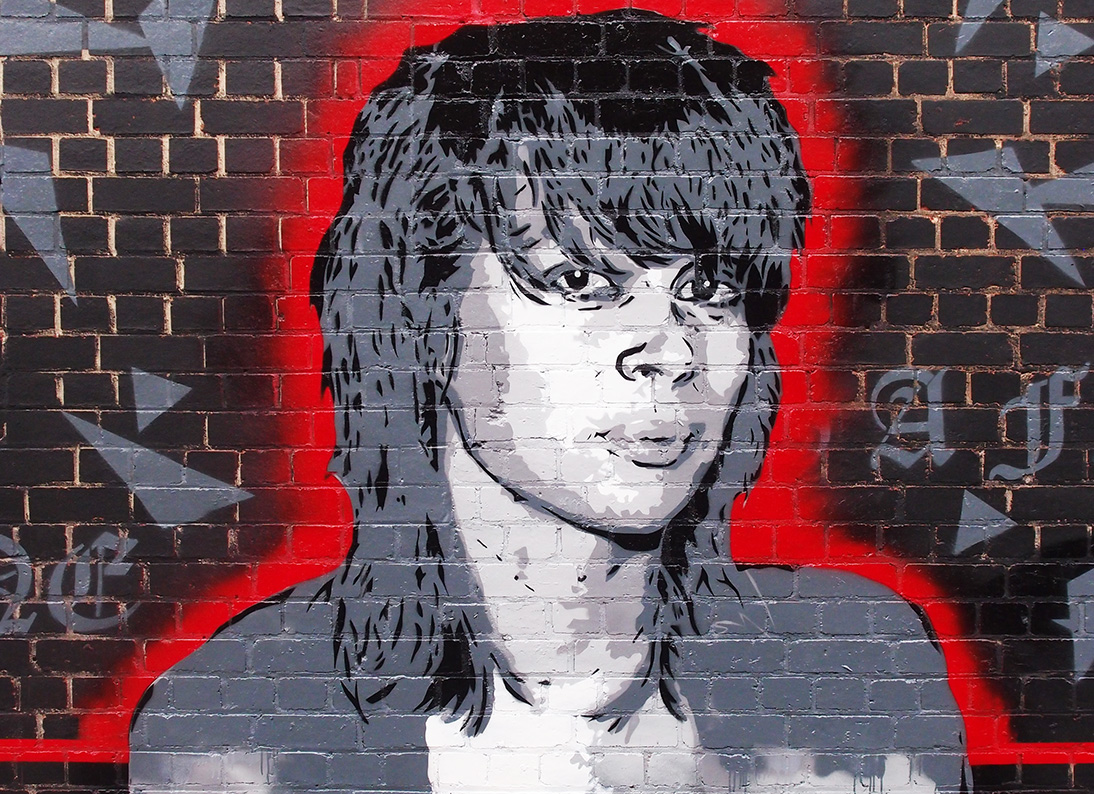 Aerosol artwork black and white with read outline of local musician 