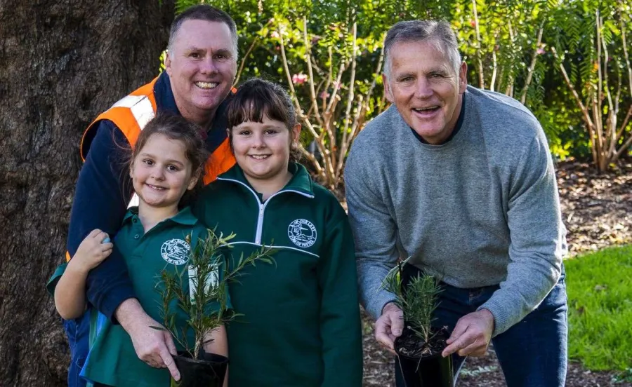 City of Greater Geelong Arborist Daniel Robins with his daughters Emanuella and Estelle and Mayor Peter Murrihy ahead of National Tree Day.