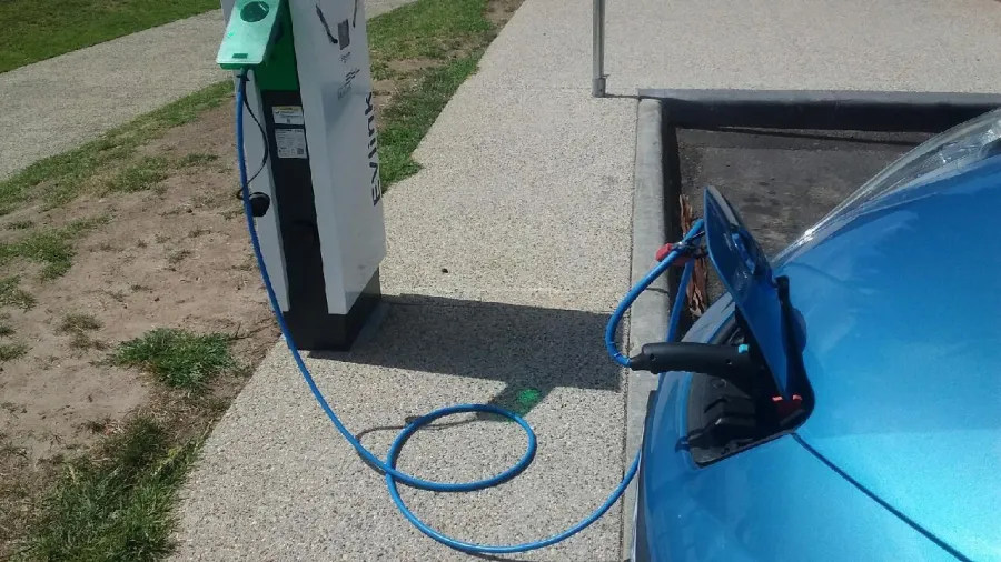 Electric Vehicle Plugged In - Increasing electric vehicle uptake