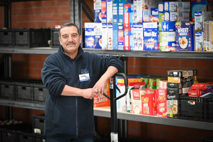 Geelong Food Relief Centre volunteer Jemal Asad in the warehouse. Geelong Food Relief Centre volunteer Jemal Asad in the warehouse.