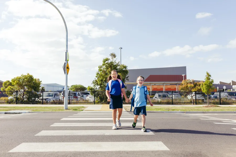 Kids crossing road to get to school.