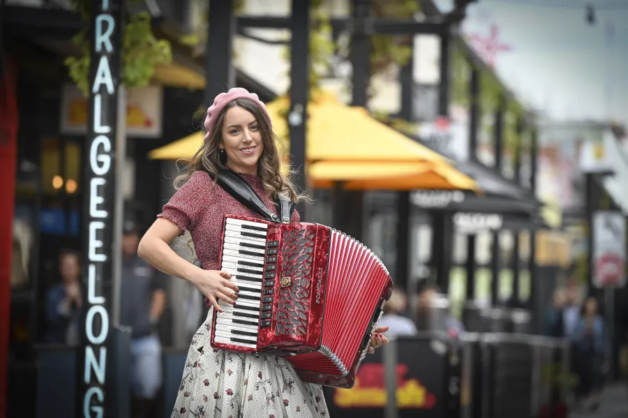 Woman playing piano accordian in Lt Malop Street, Geelong.
