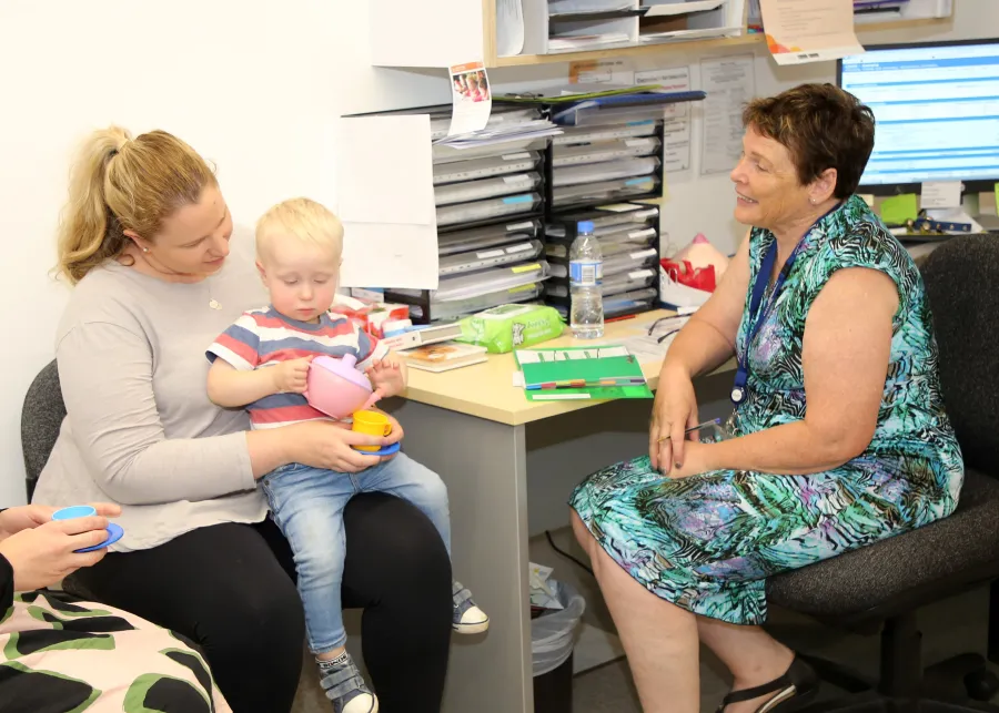 Mother and child in maternal and child health consultation.