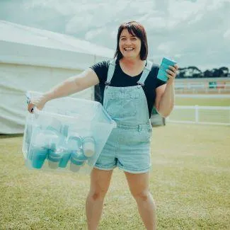 Community Waste Hero - Jess holding her Keep Cups