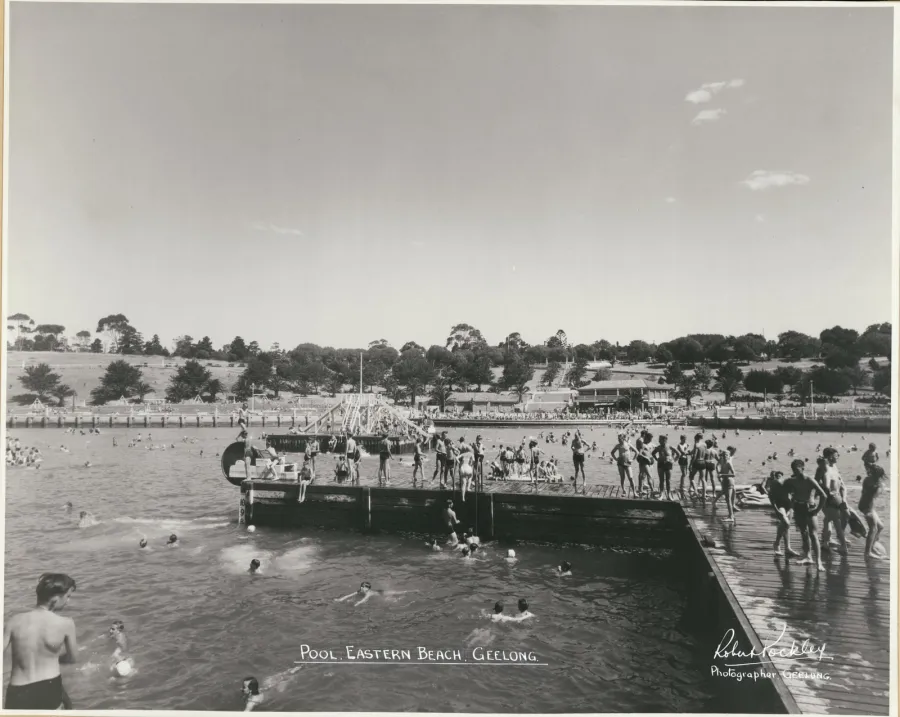 Black & white photograph of Eastern Beach by local photographer Robert Pockley showing bathers on the promenade, c.1950s. State Library of Victoria 