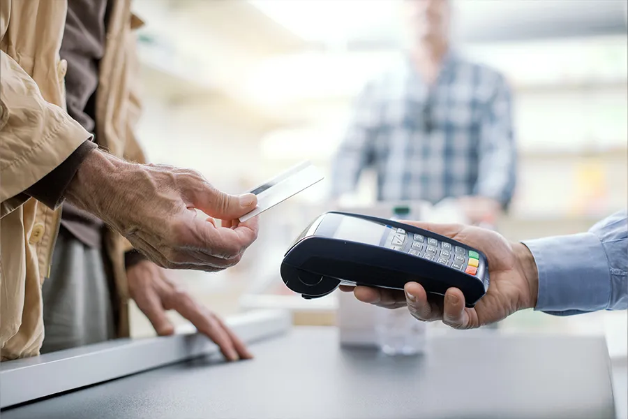 Pensioner paying a bill Pensioner paying a bill