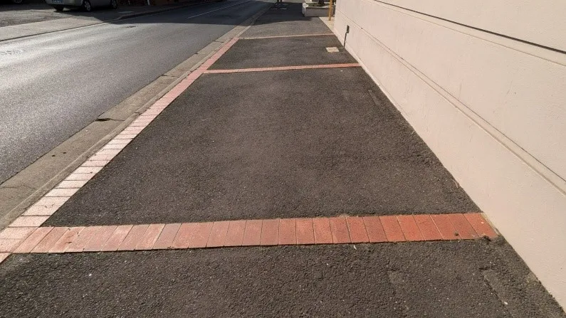 Proposed footpath with brick paving boarder and asphalt