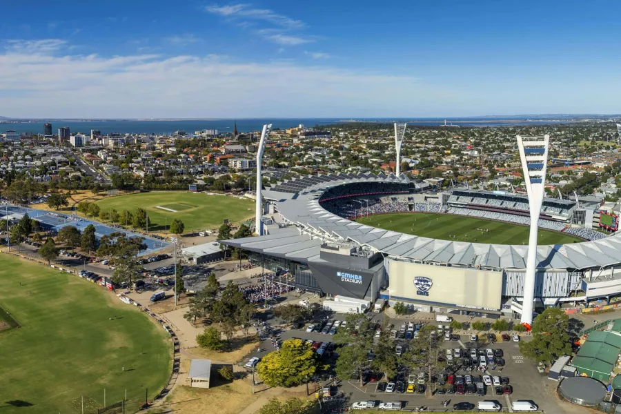 GMHBA Stadium at Kardinia Park Aerial view of GMHBA Stadium in Geelong, showing the football oval, surrounding grandstands, nearby parkland, and the city extending toward the coastline.