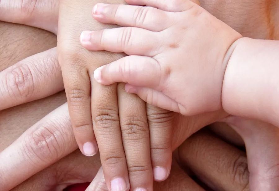 Layered image of hands representing parenting manifesto