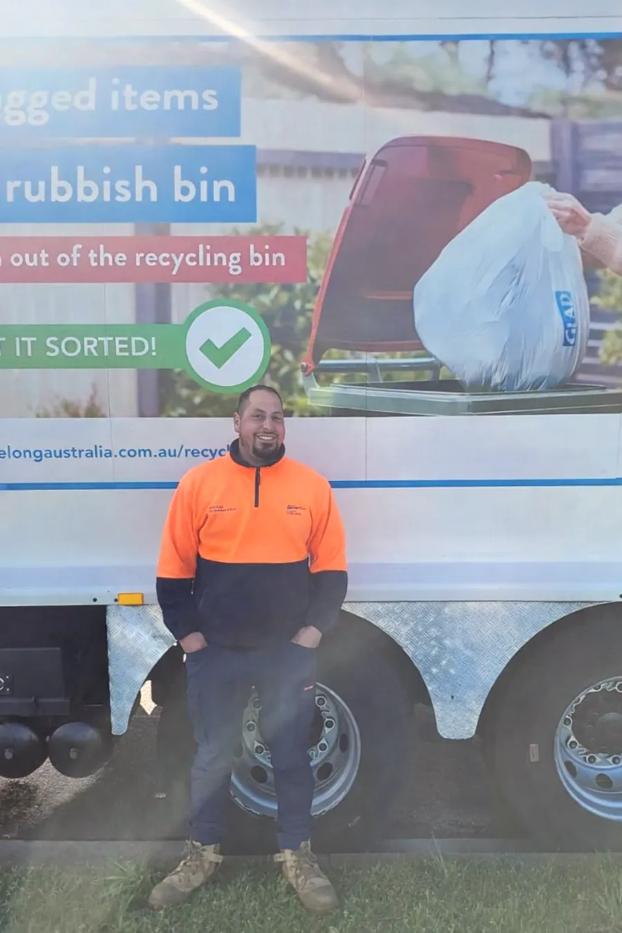 Senior Audit and Inspection Officer Assaad Man standing in front of a truck
