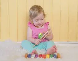 hey dee ho Image of child playing musical instrument