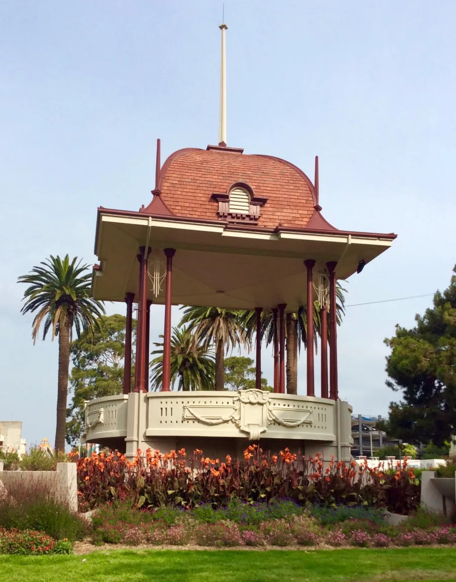 Heritage bandstand located in Johnstone Park surrounded by plants and flowers.