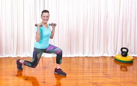 Image of lady exercising with dumbbells