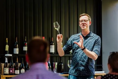 man holding wine glass