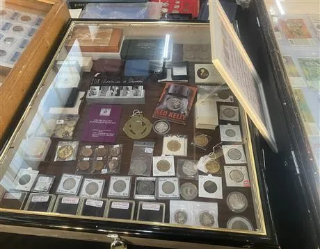 Image of collectable coins in display cabinet