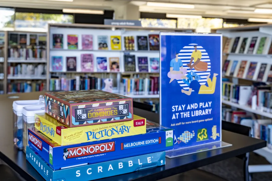 A stack of board games at a library