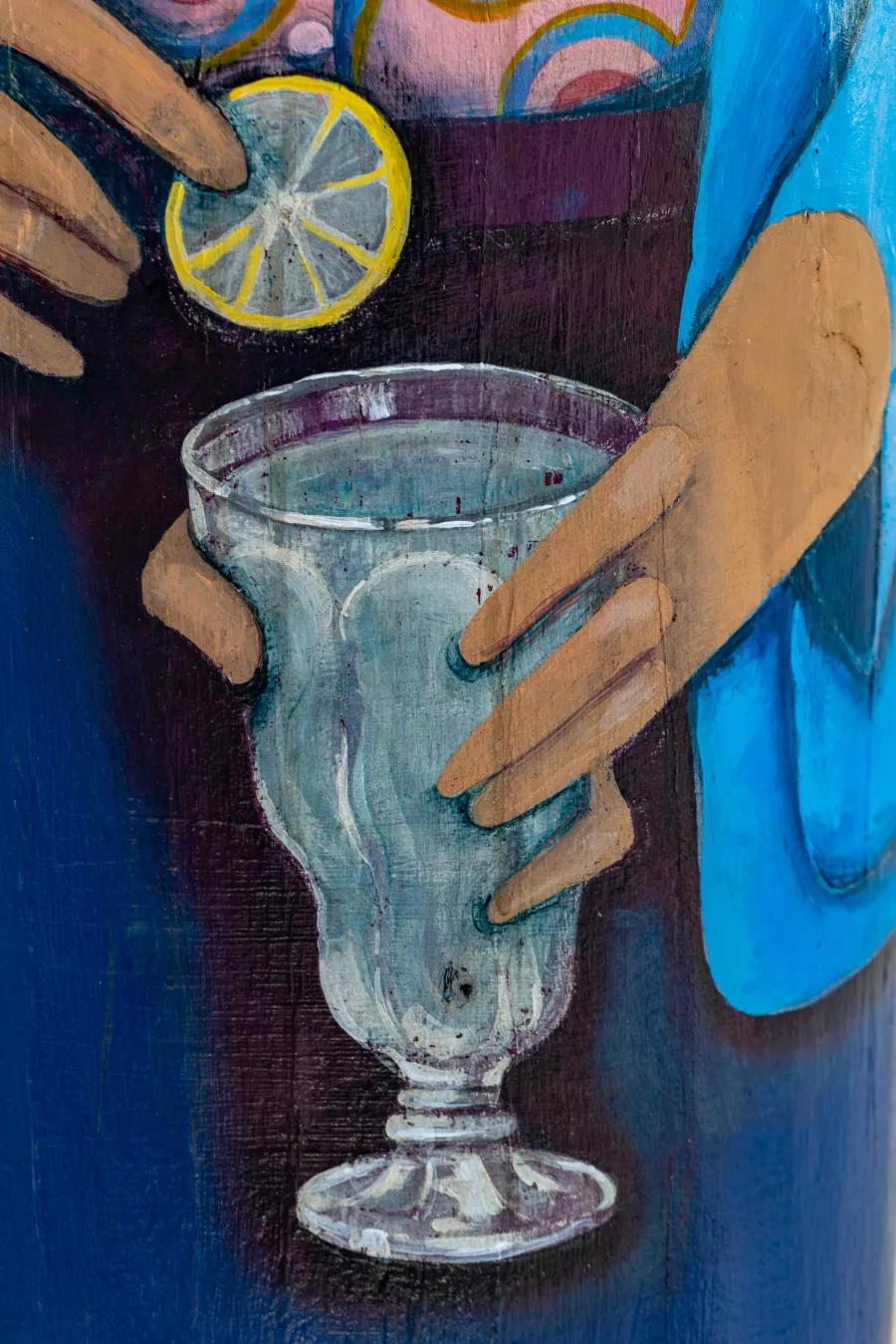 Painted image of lemonade and slice of lemon on bollard