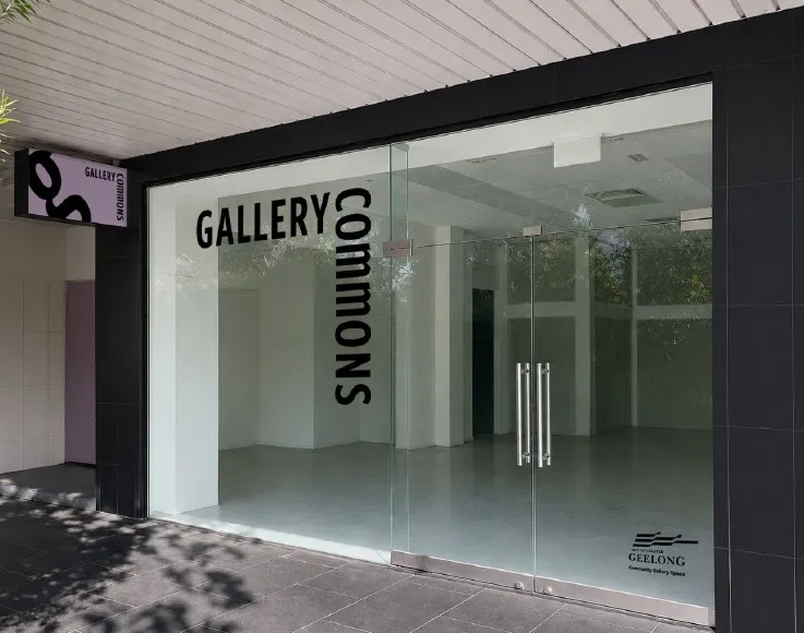 Gallery Commons Front window black and white signage for Gallery Commons