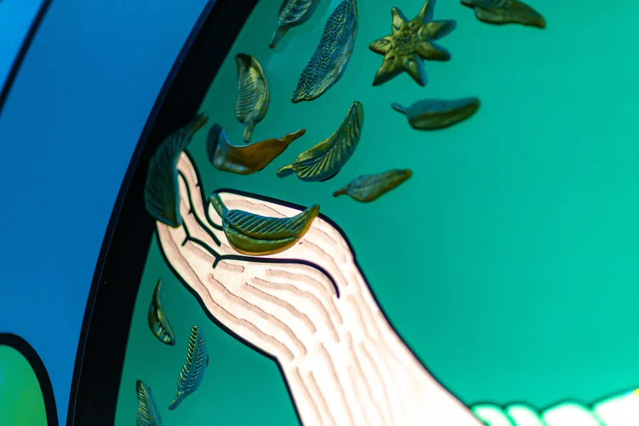 Close up of a man's hand holding leaves