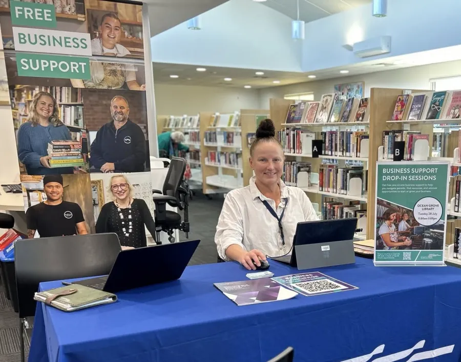 Business Support Officer Lady siting behind a desk