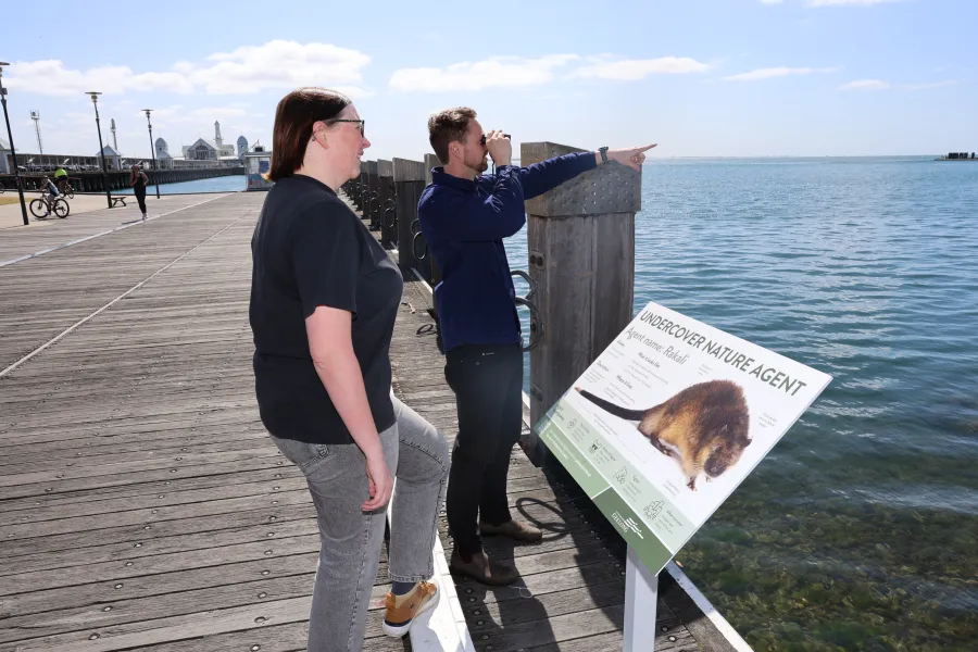 Coastal management officer Billy McNeill and Sophie Hayes at the new waterfront rakali sign, part of the Geelong Waterfront Safari event for Nature Week Coastal management officer Billy McNeill and Sophie Hayes at the new waterfront rakali sign, part of the Geelong Waterfront Safari event for Nature Week