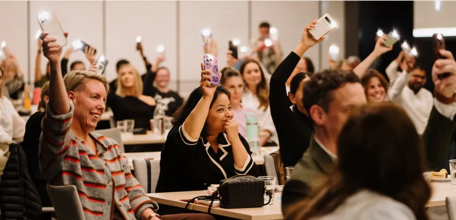 Digital Solutions Program People holding their phones up