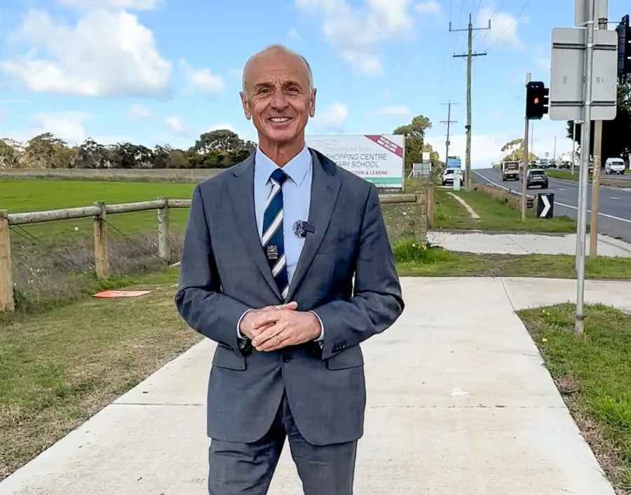 Mayor Stretch Kontelj OAM at intersection of Baanip Boulevard and Surf Coast Highway Mayor Stretch Kontelj OAM stands at intersection of Baanip Boulevard and Surf Coast Highway