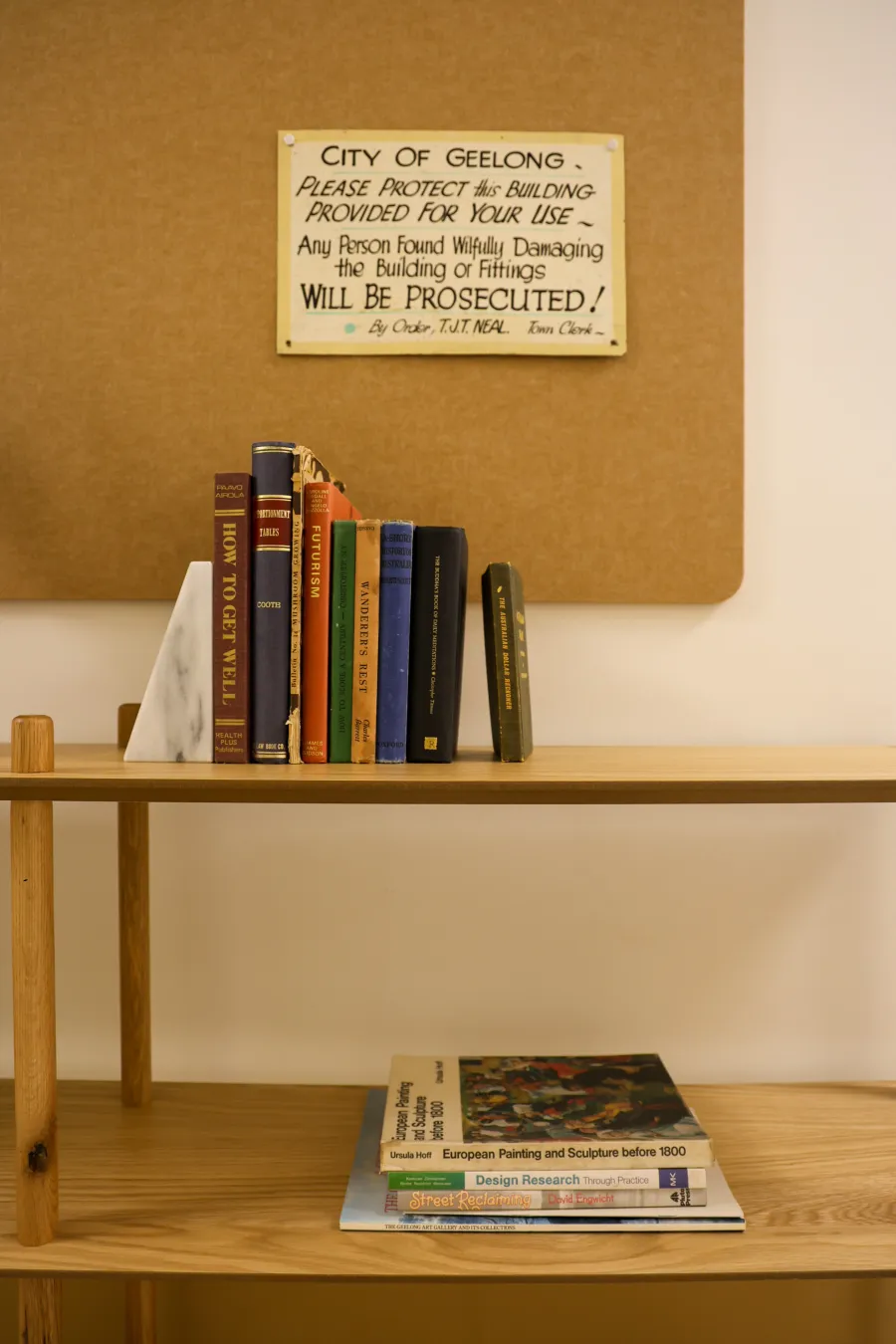 Bookshelf with vintage books and signage