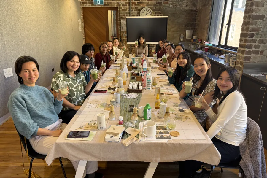 Guests enjoying matcha lattes at a NOA Matcha ceramic painting workshop