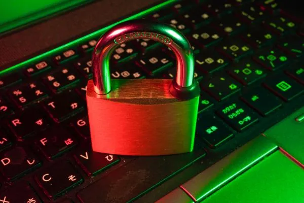 An image of a keyboard with a padlock in front of it