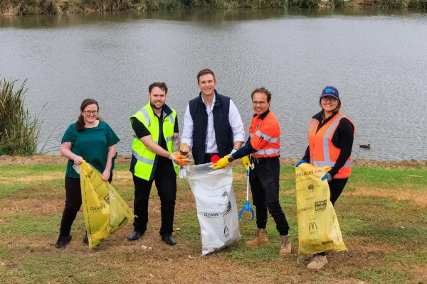 Miranda Laird from Friends of Cowies Creek, Jordan Cammaroto from Corio Waste Management, Greater Geelong Mayor Trent Sullivan with Pedro Cascão and Lauren Andrews from Geelong Port at Seagull Paddock North Geelong.