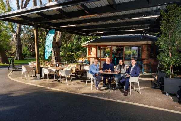Cr Eddy Kontelj, the Hon Richard Marles MP, Cafe Manager Kira Hunn and Geelong Mayor Trent Sullivan