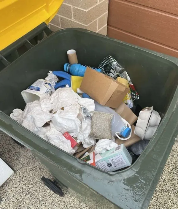 Common contamination in recycling includes soft plastics and paper towels.