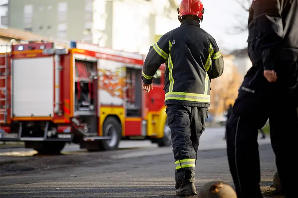 Fire Safety Fire fighters walking to a fire truck