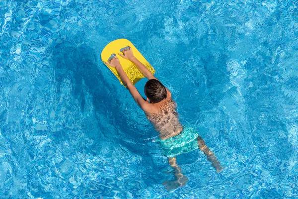 Swimming pool Aerial of boy swimming in a pool