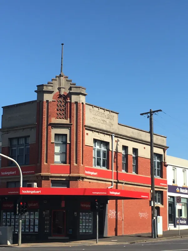 Leggo's Grocery Shop Edwardian red brick corner building with bold futuristic architectural corner parapet'