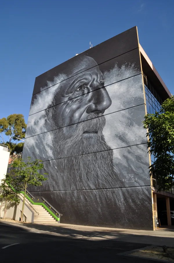 The Unknown Mariner Large scale mural of a man's face coming out of the sea