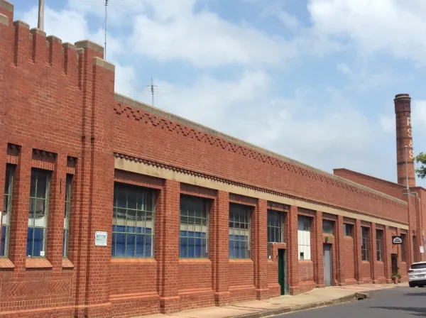 Returned Sailors and Soldiers Woolen Mill Historic red brick woollen mill with smokestack and factory windows