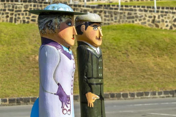 Car Rally Picnickers Two painted bollards of a husband and wife out for a weekend drive, dressed in formal weekend clothing. They are holding tools and driving googles which was the style at the time.