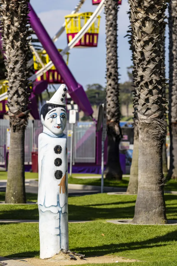 Pierrot Painted bollard of a local performer, dressed in white face and white costume and hat with large black buttons.