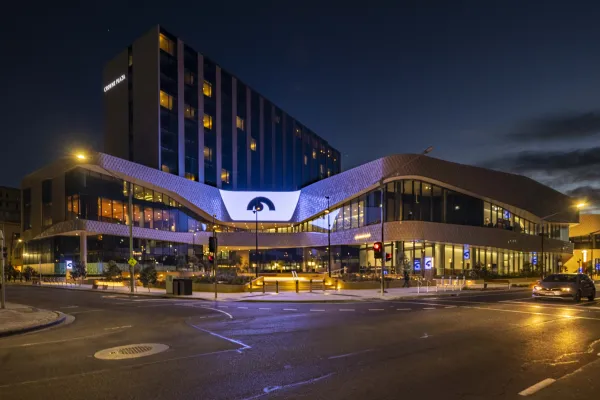 Nyaal Banyul - Geelong Convention and Event Centre Large modern convention centre at night with illuminated signage and streetlights.