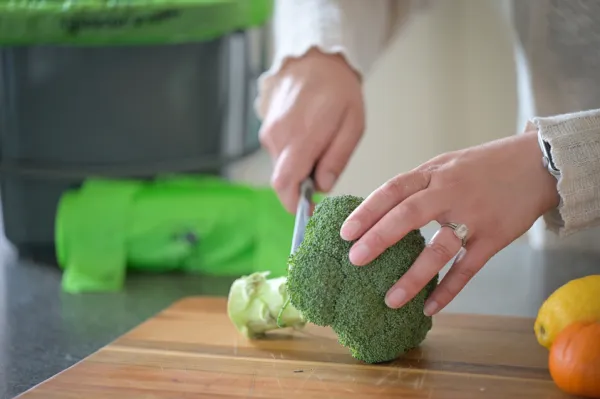 Woman cutting vegetables to make a meal