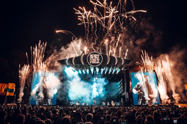 A stage at Spilt Milk festival during a performance with fireworks