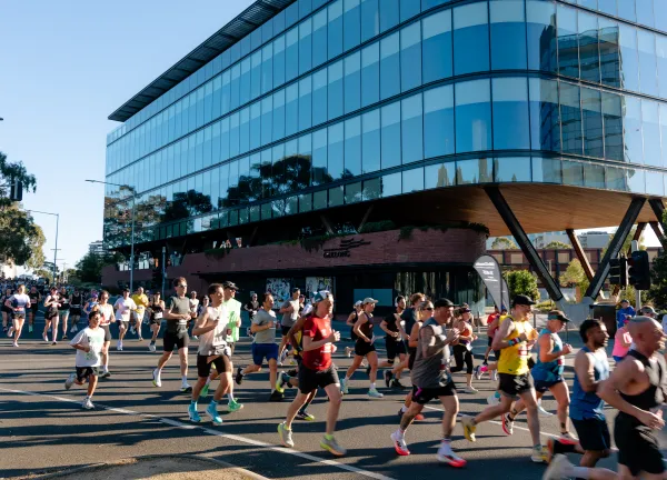 Runners go past Wurriki Nyal, City of Greater Geelong's civic precinct.