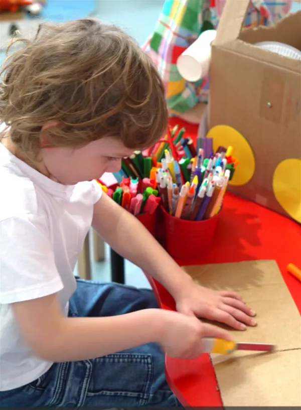 boy playing with craft boy playing with craft