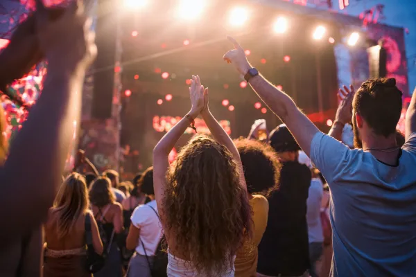 Live concert with people cheering in crowd