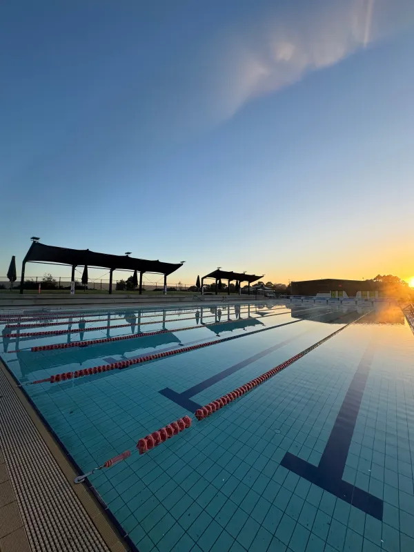 Outdoor pool at Linda McGill Aquatic Centre as the sun rises